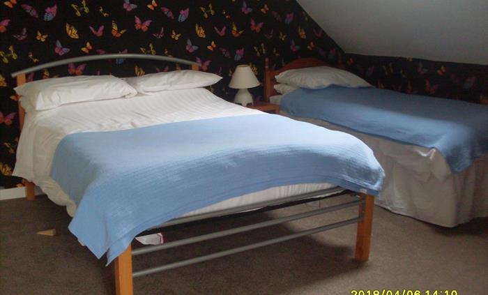 Double and two single beds, ideal for families and groups.